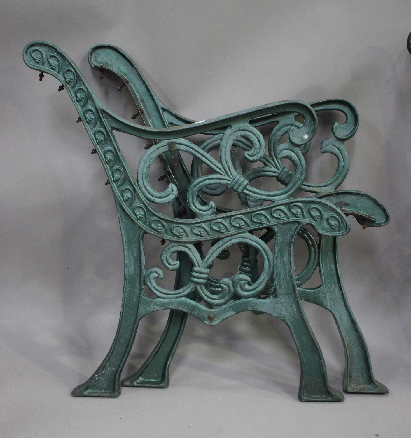 A pair of early 20th century green painted cast iron bench ends of scroll form, height 83cm, depth - Image 2 of 3