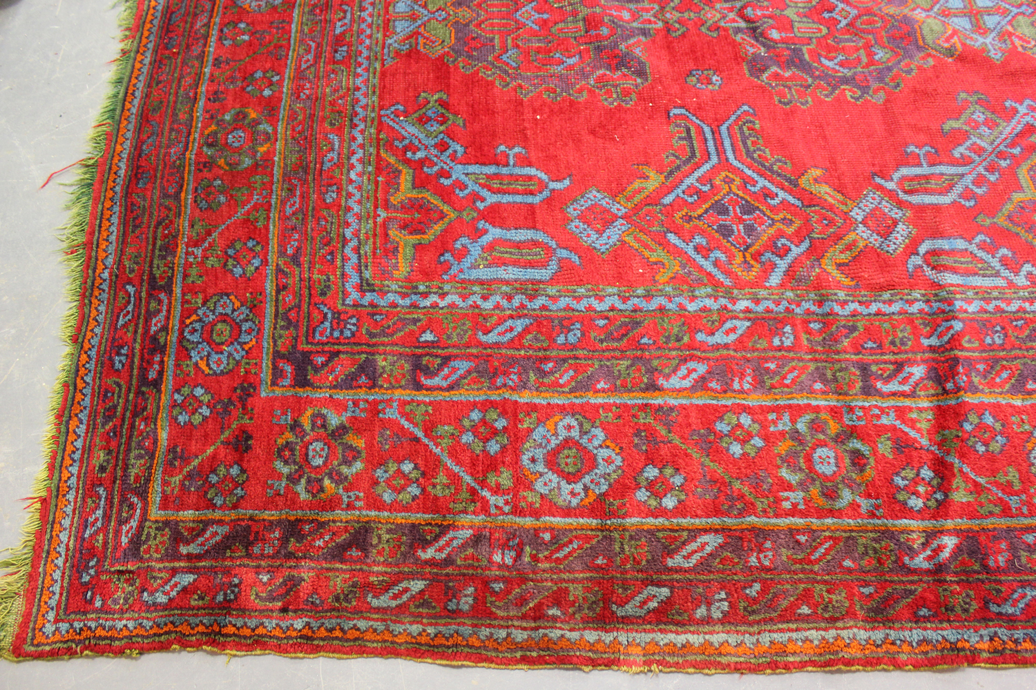 A large Turkish 'Old Turkey' carpet, early 20th century, the red field with overall palmettes and - Image 6 of 11