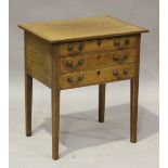 A late George III mahogany side table, fitted with three drawers and with boxwood stringing,