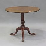 A late George III mahogany tip-top wine table, on tripod cabriole legs, height 72cm, diameter 83cm.