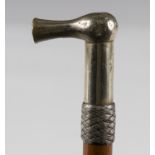 A late 19th century Malacca horseman's cane, the nickel handle shaped to help open gates, above a