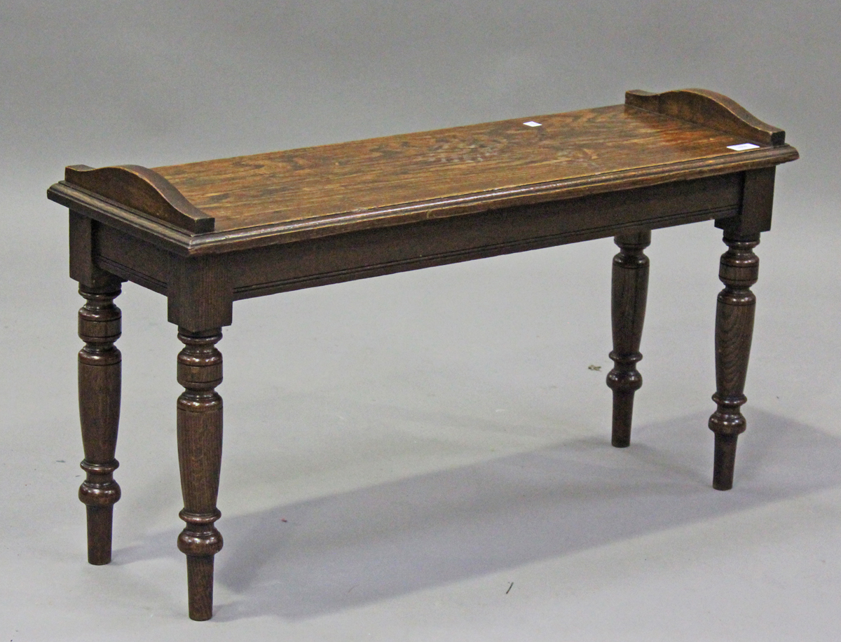 An Edwardian oak window seat, in the manner of James Shoolbred, height 51cm, width 91cm, depth