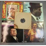 A group of LP records, including Monk's Dream by The Thelonius Monk Quartet, two Elvis Presley 78rpm