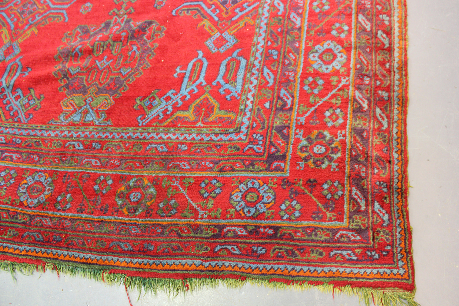 A large Turkish 'Old Turkey' carpet, early 20th century, the red field with overall palmettes and - Image 10 of 11