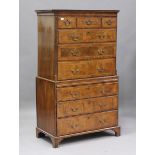 A George I walnut chest-on-chest with crossbanded and feather banded borders, the cavetto moulded