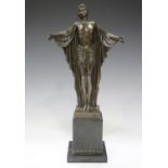 After Chiparus - a modern cast bronze figure of standing semi-clad maiden, bearing facsimile