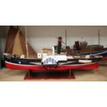 A late 20th century plastic, wooden and metal model of a paddle steamer, length 100cm, together with