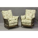 A pair of Ercol Renaissance model armchairs, height 101cm, width 80cm, depth 97cm.Buyer’s Premium
