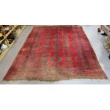 A large Turkish 'Old Turkey' carpet, early 20th century, the red field with overall palmettes and