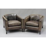 A pair of mid/late 20th century brown leather Marlborough style tub back armchairs, possibly