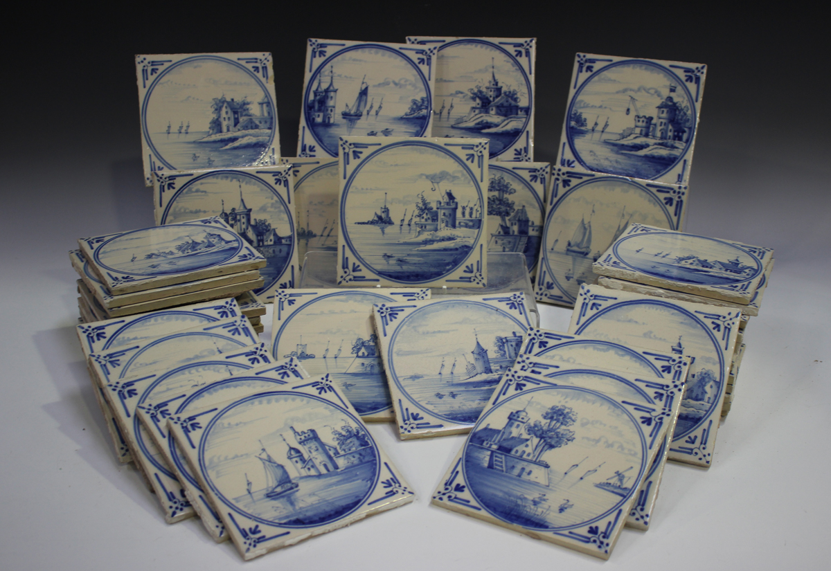 A group of approximately sixty Dutch Delft blue and white tiles, late 19th/early 20th century,