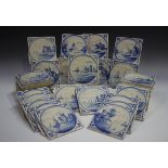 A group of approximately sixty Dutch Delft blue and white tiles, late 19th/early 20th century,