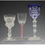 A Continental colour twist wine glass, 19th century, with rounded bowl, the plain stem with a pair