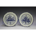 A pair of English pearlware plates, circa 1790, each painted in blue with a chinoiserie pagoda