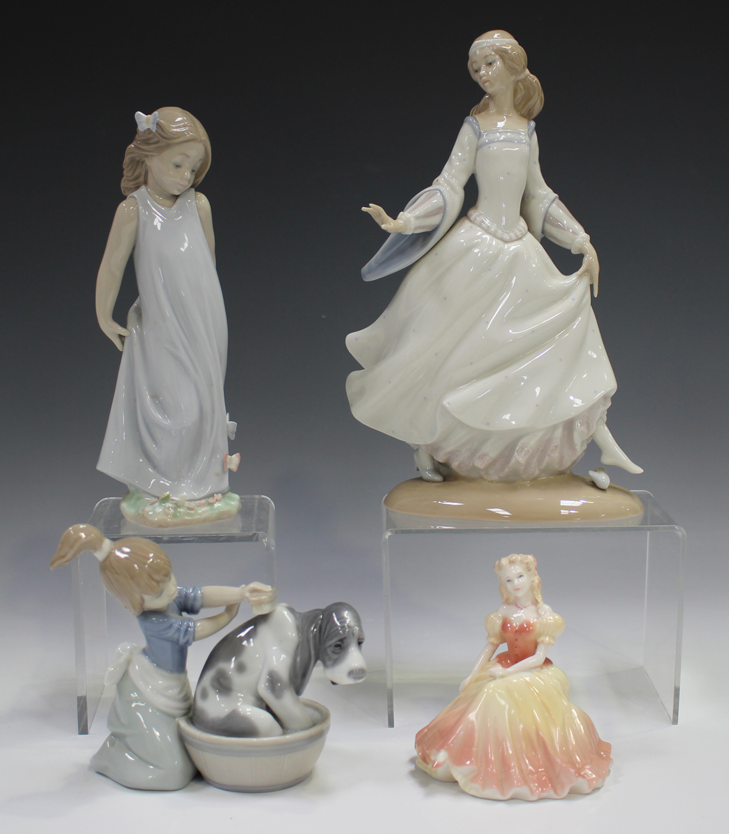 Three Lladro figures, comprising Cinderella, No. 4828, Bashful Bather, No. 5455, and Friend of the