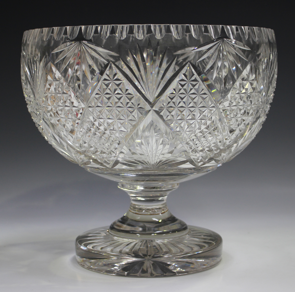 A large cut glass punch bowl, early 20th century, the circular bowl with diamond shaped hobnail