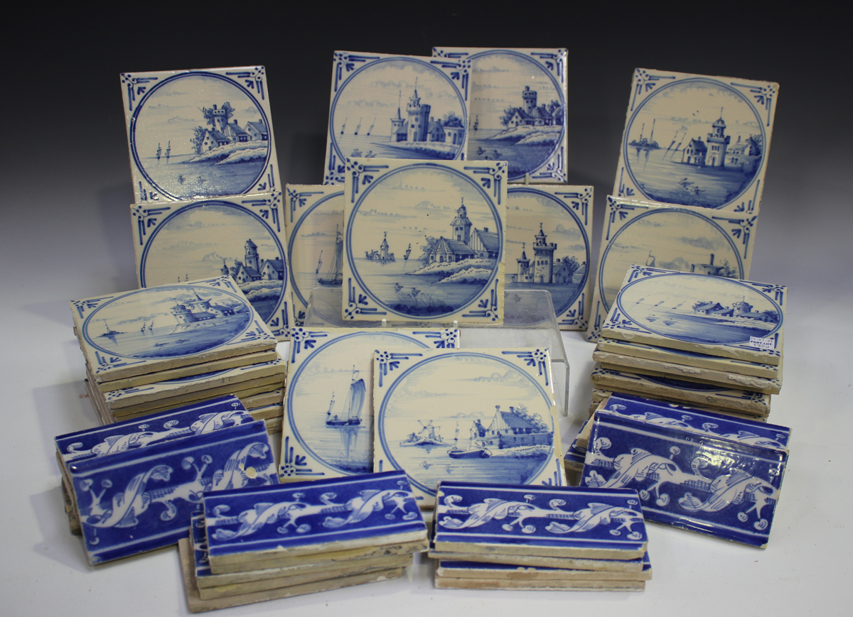 A group of approximately fifty Dutch Delft blue and white tiles, late 19th/early 20th century,