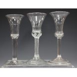 A plain stem wine glass, mid-18th century, with subtle bell bowl and conical foot, height 15.8cm,