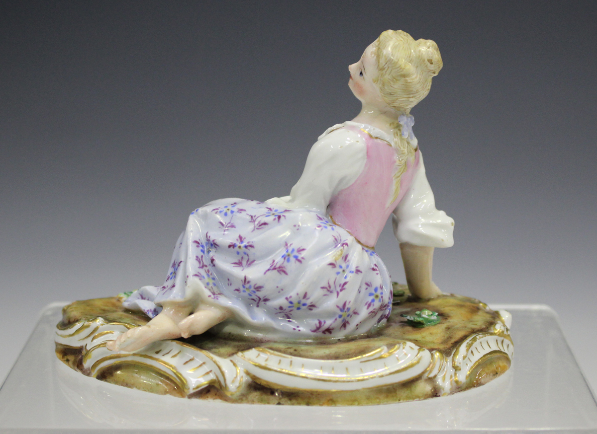 A Meissen figure of a recumbent girl, late 19th century, modelled on a naturalistic base with gilt - Image 5 of 5