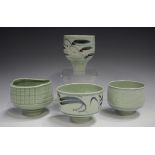 Four Derek Clarkson studio porcelain footed bowls, each decorated with a celadon glaze, two with