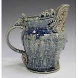 A Jennie Hale studio pottery salt glazed bird jug, 1980s, decorated in blue/brown with raised