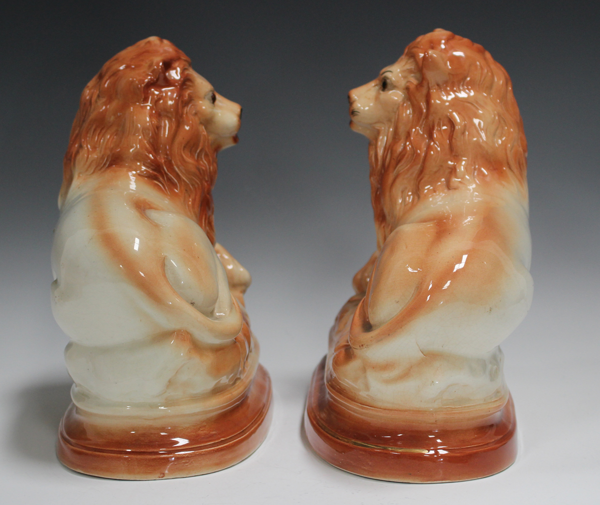 A pair of Staffordshire pottery lions, late 19th/early 20th century, inset with glass eyes, length - Image 3 of 3