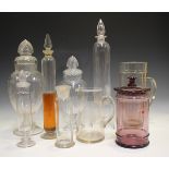 A graduated pair of moulded glass pharmacy jars and covers, first half 20th century, each ovoid body