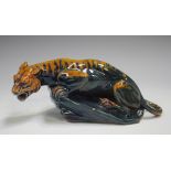 A rare Royal Doulton Sung Flambé tiger, early 20th century, designed by Charles Noke, modelled