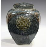 A David Frith studio pottery jar and cover of high-shouldered form, the mottled blue ground