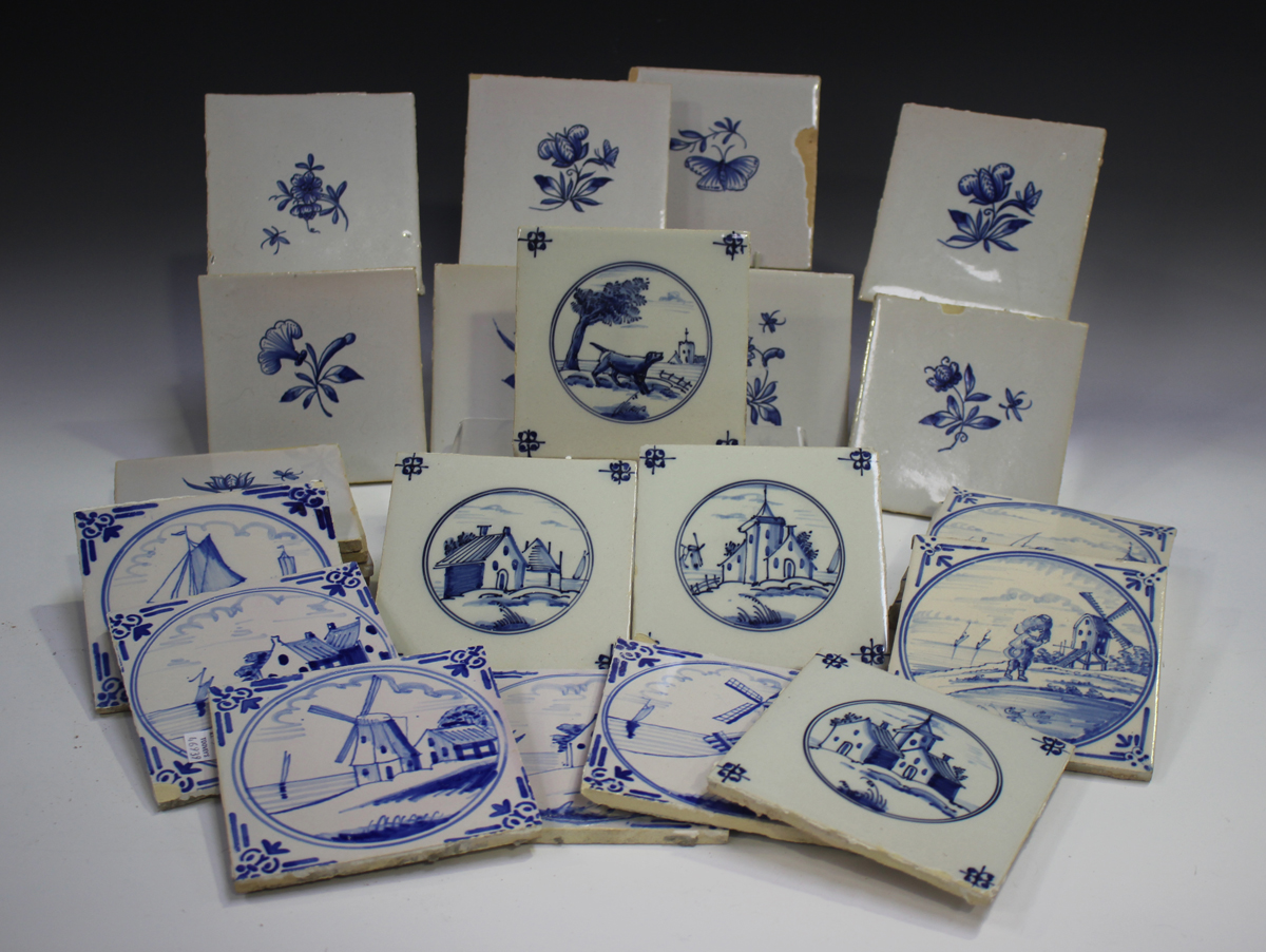 A group of approximately sixty Dutch Delft blue and white tiles, late 19th/early 20th century,