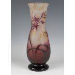 A Daum Nancy cameo glass vase, early 20th century, of waisted form, decorated with flowers and