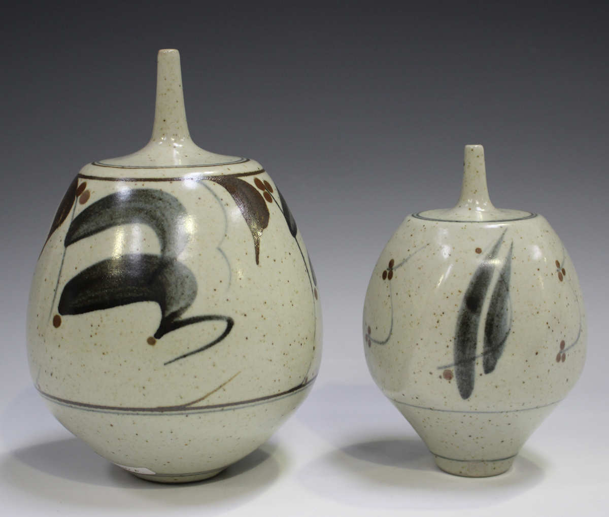 Two Derek Clarkson studio pottery vases, each with a narrow neck above a bulbous body, the oatmeal