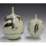 Two Derek Clarkson studio pottery vases, each with a narrow neck above a bulbous body, the oatmeal