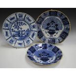 Three Dutch Delft chargers, mid to late 18th century, comprising one painted with a chinoiserie