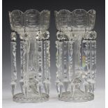 A pair of clear glass lustres, early 20th century, the circular tops with scalloped rims, cut with