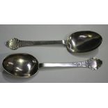 A pair of Charles II silver lace-back trefid spoons, each bowl back with ribbed rat tail and foliate