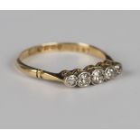 An 18ct gold and diamond five stone ring, mounted with a row of graduated cushion cut diamonds,