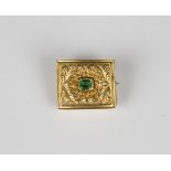 A gold and green paste set rectangular brooch, the central green paste with a floral and scrolling