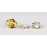 A gold and pale blue gem set solitaire ring, detailed '14K', weight 6.8g, ring size approx P1/2, a