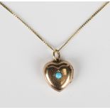 A gold and turquoise heart shaped pendant locket, circa 1910-20, weight 3.5g, length 2cm, with a