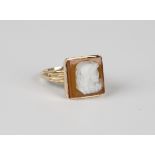 A 9ct gold ring, mounted with a square agate cameo designed as a portrait of a classical warrior,