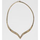 A 9ct three colour gold collar necklace, the front in a 'V' shaped design, decorated with beaded