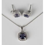 A white gold, iolite and diamond cluster pendant, detailed '375', length 1.5cm, on a 9ct white