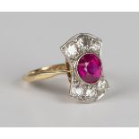 A gold and platinum ring, collet set a circular cut synthetic ruby and two rows of three cushion cut