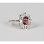 A platinum, pink tourmaline and diamond hexagonal cluster ring, collet set with the cut cornered