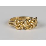 A late Victorian 18ct gold ring in an interwoven design, Birmingham 1897, weight 7.2g, ring size