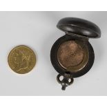 A France Napoleon gold twenty francs 1811, with a gun metal sovereign case.Buyer’s Premium 29.4% (