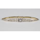 A diamond and sapphire bracelet in an Art Deco style, collet set with the principal circular cut