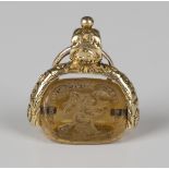 A Victorian gold mounted citrine triple sided rotating fob seal, engraved with mottos and emblems,