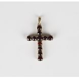 A 9ct gold and garnet pendant cross, mounted with circular cut garnets, weight 2.6g, length 3.6cm,